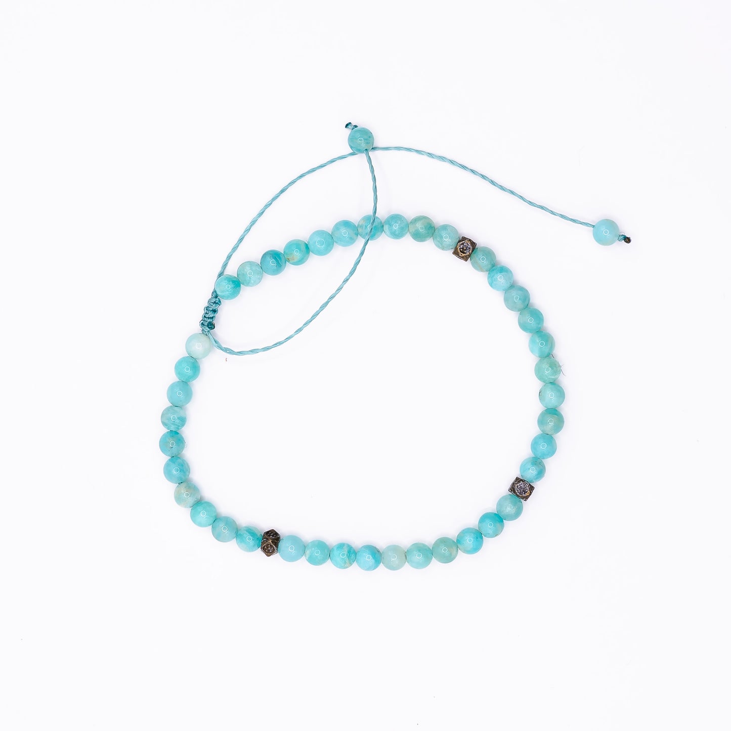 An Amazonite Sliding Knot Anklet laid on a white background. 