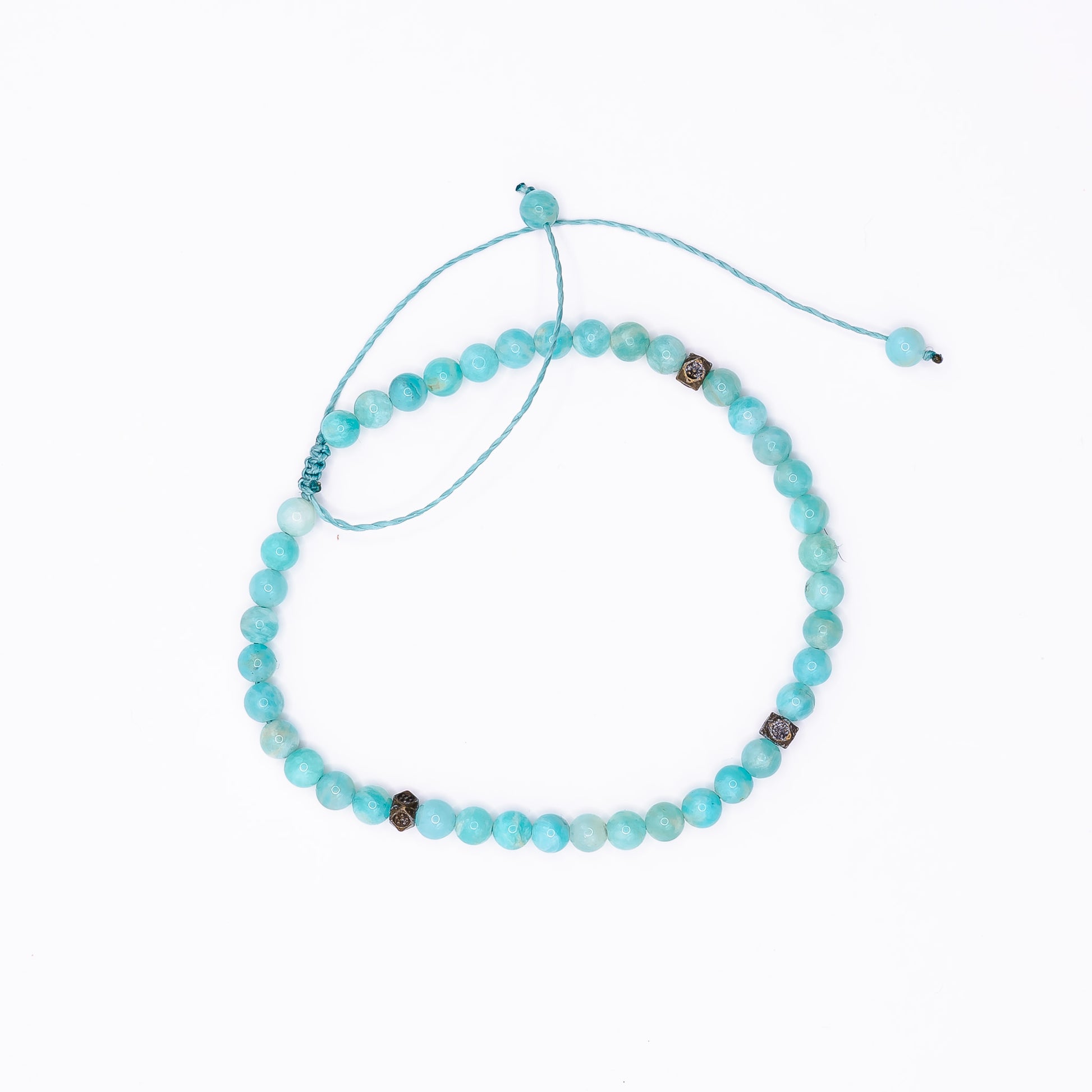 An Amazonite Sliding Knot Anklet laid on a white background. 