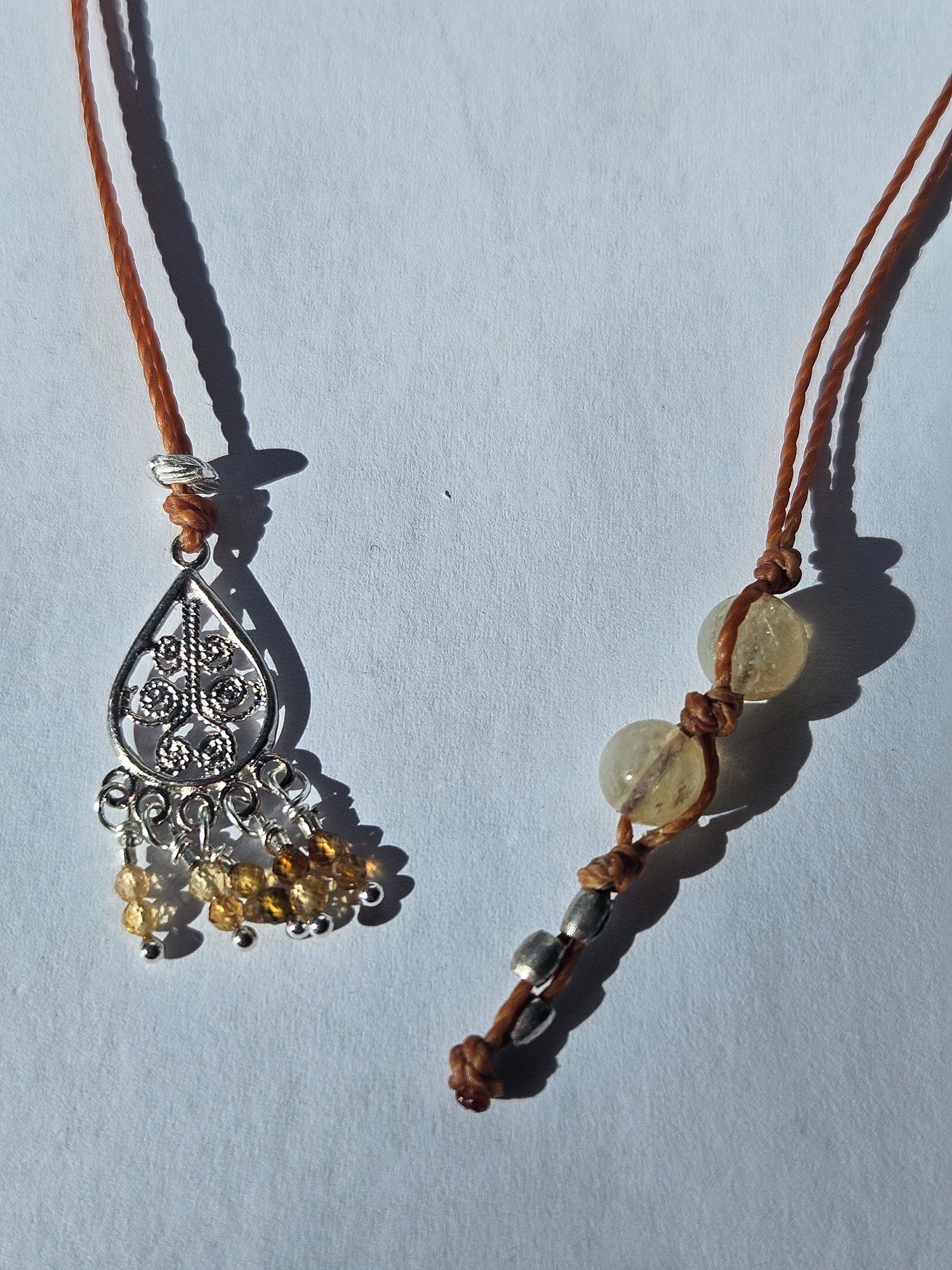 A gemstone bookmark sitting on a light background.