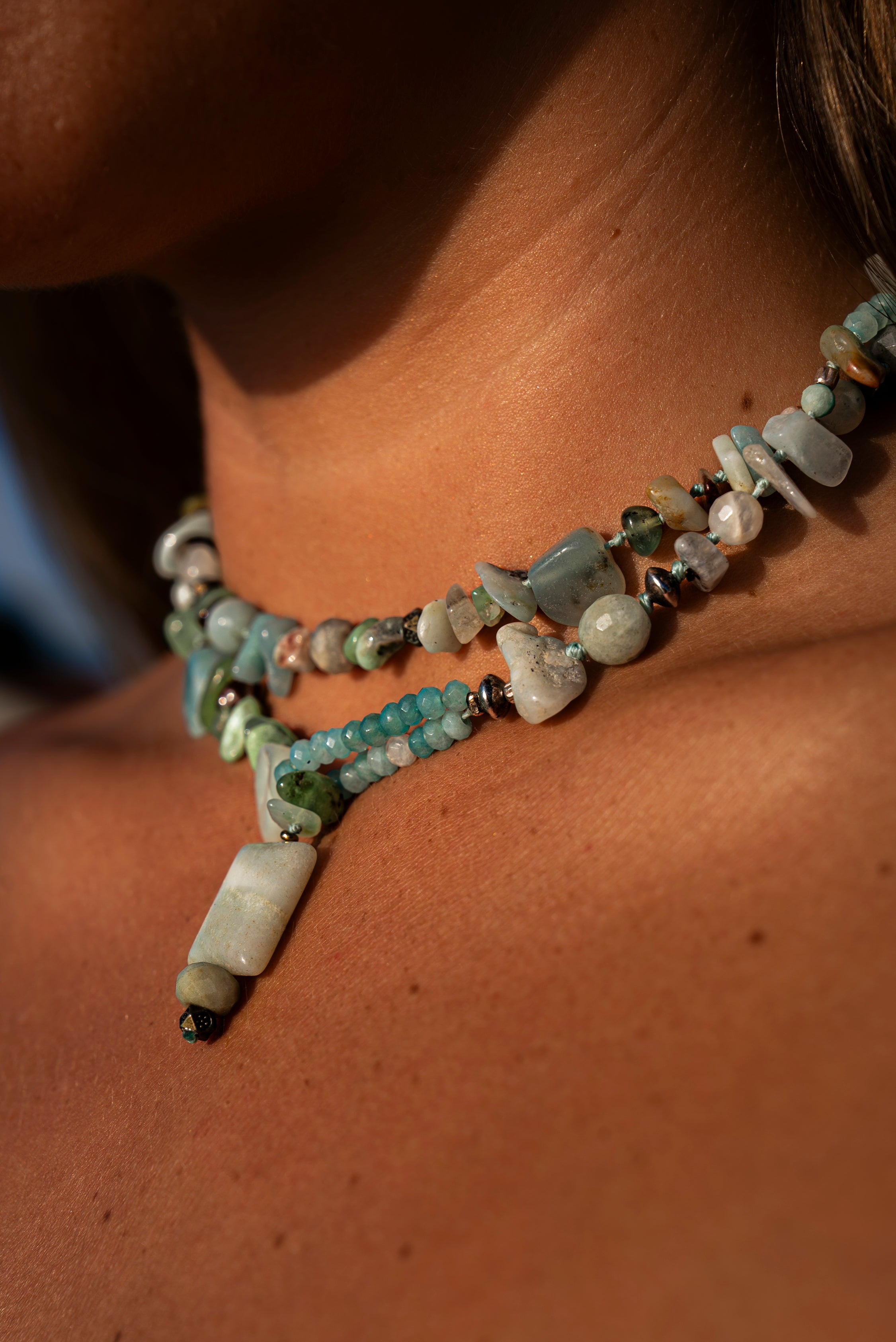 Young woman wearing a Soul and Stone gemstone lariat necklace.