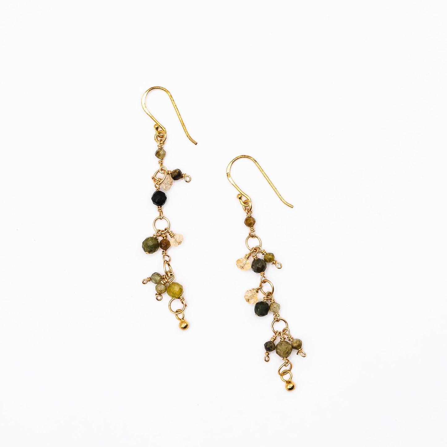 A pair of Soul and Stone Drop Gemstone Earrings laid on a white background.