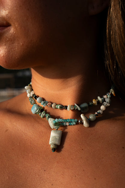 Young woman wearing a Soul and Stone gemstone lariat necklace in a choker style.