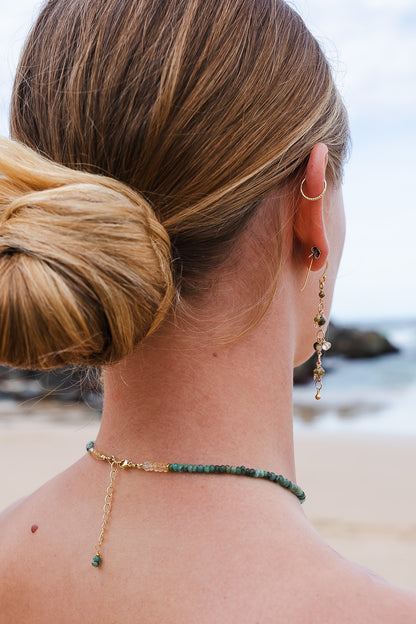 Young woman wearing a Soul and Stone hand-knotted gemstone choker necklace.